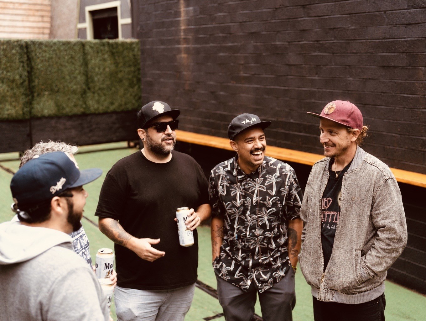 Alific and the full live band gathered together in a huddle